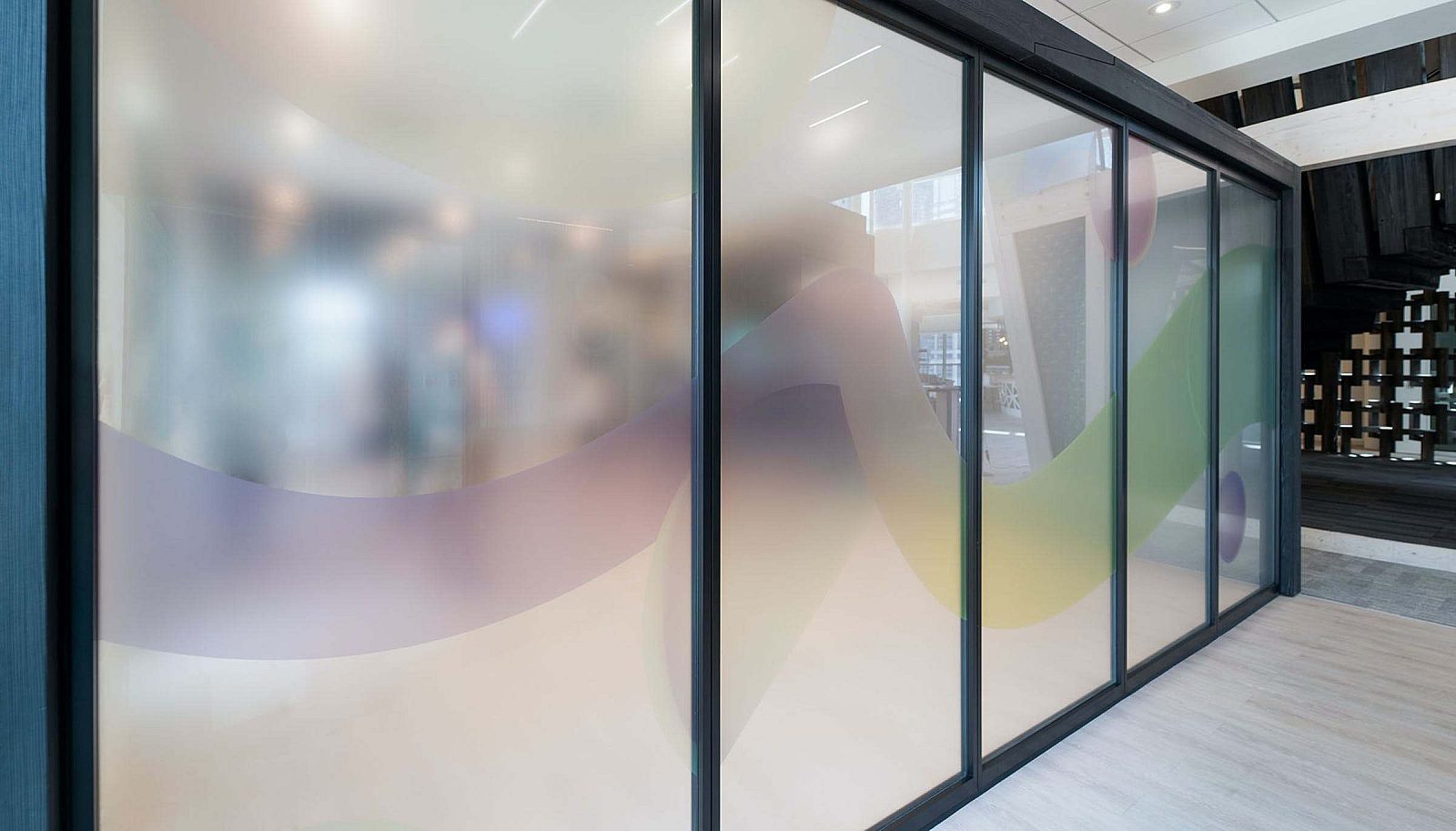 A glass wall with 5 panes and black trim