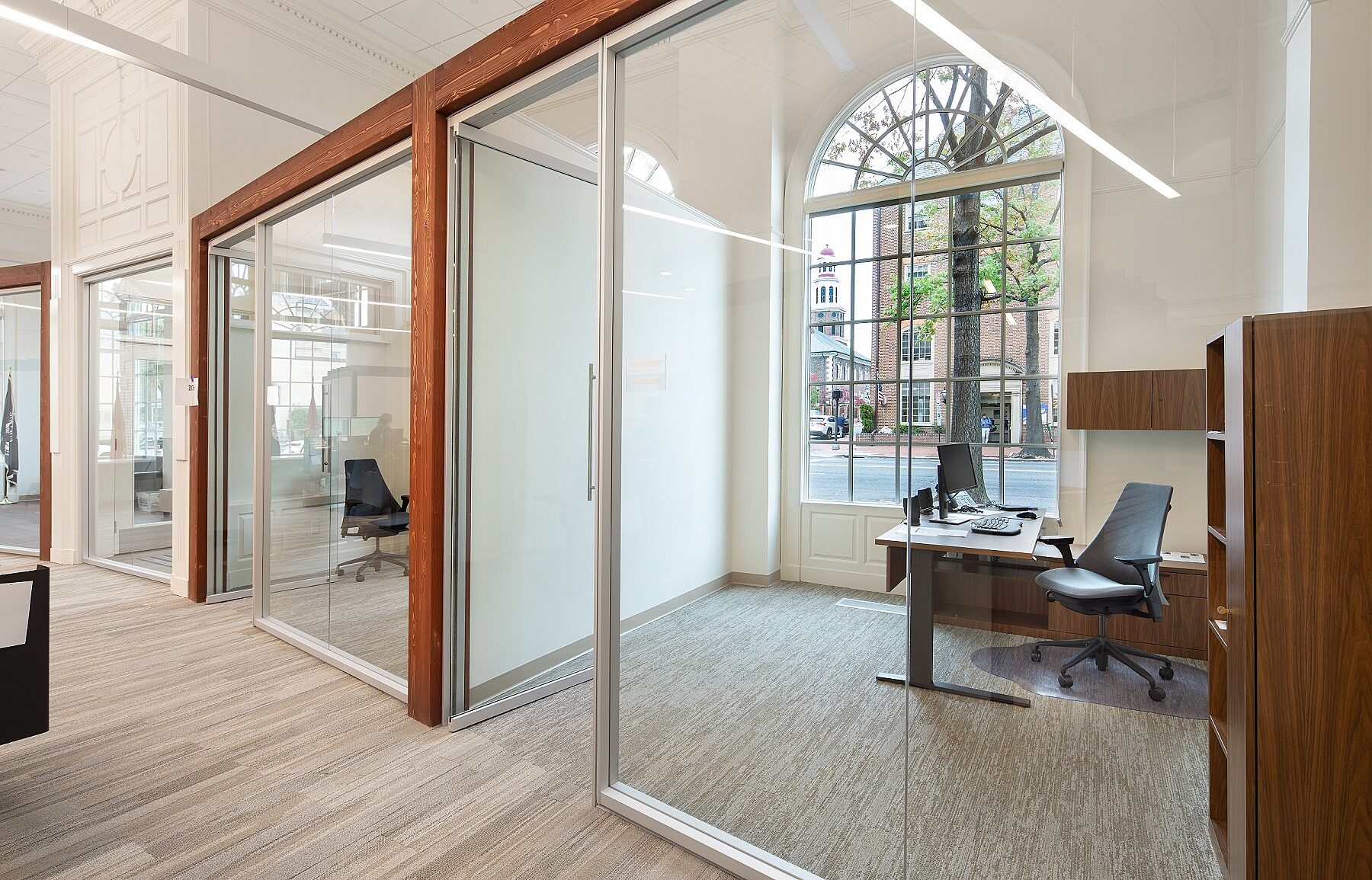Multiple offices with glass fronts.