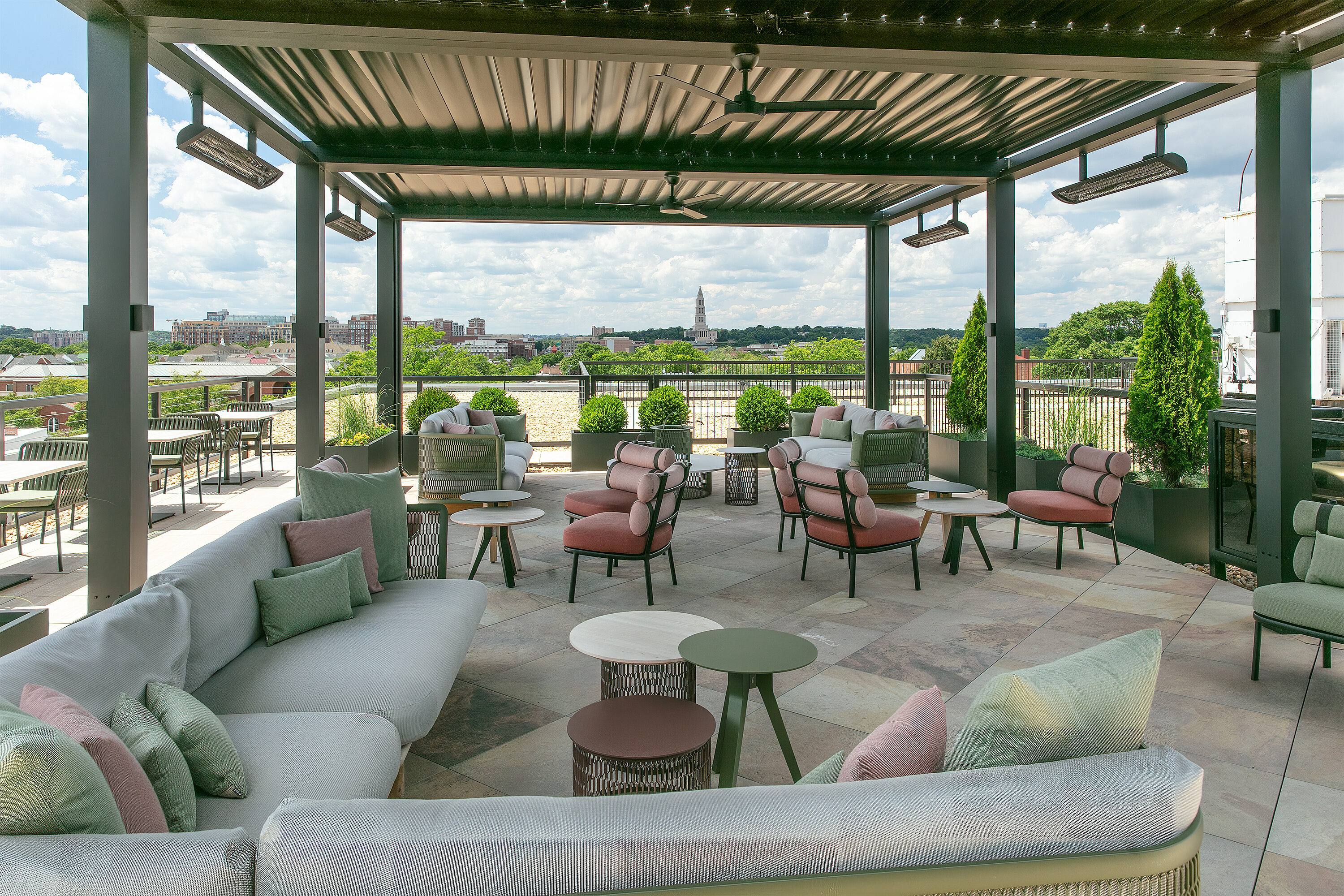 An outdoor lounge area with multiple furniture groups