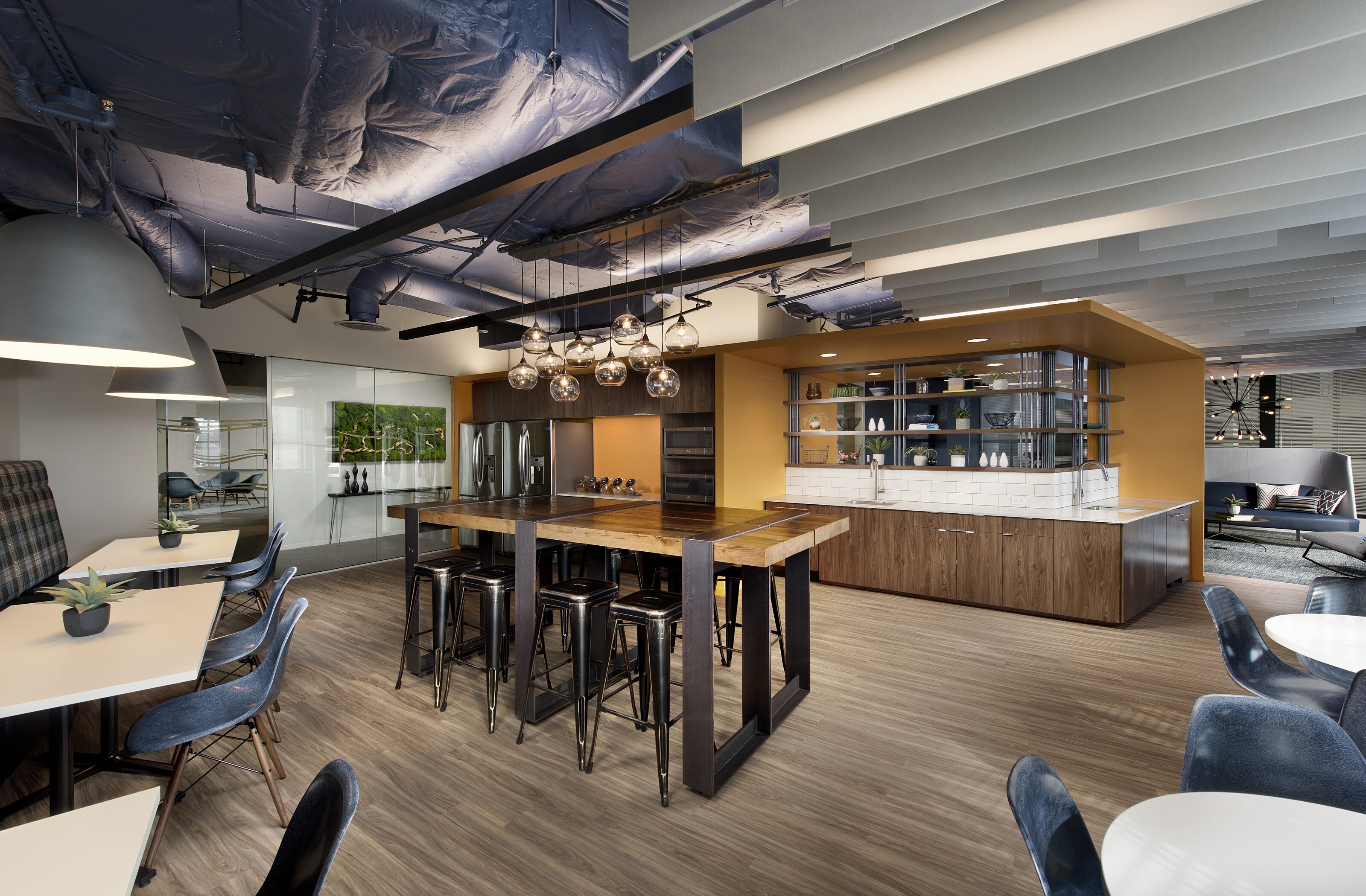 A pantry with various tables and seating